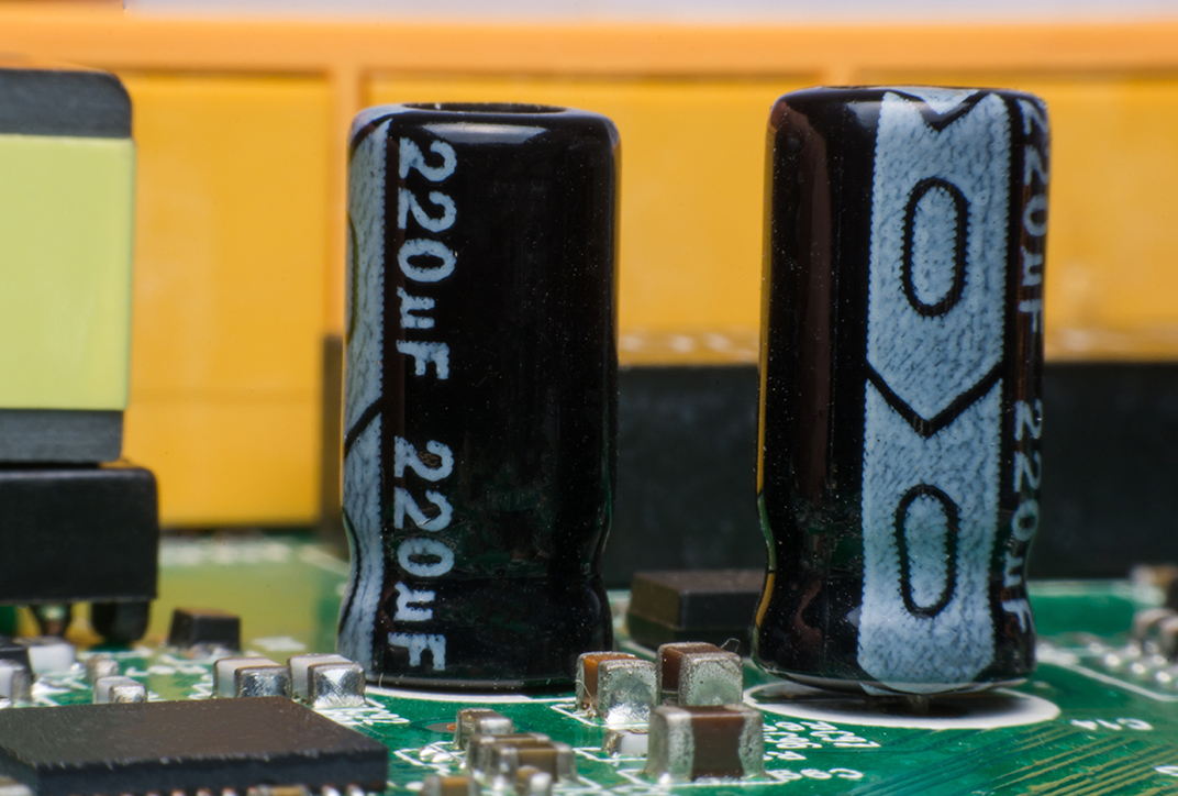 A circuit board with various small electronic components. A circuit board with various small electronic components.