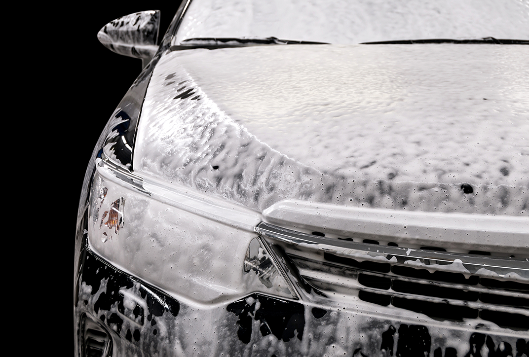 A car covered with shampoo.