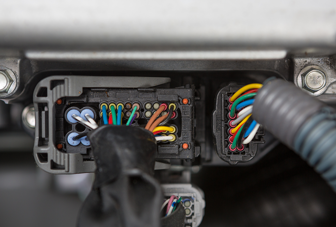A view of cabling in a car. A view of cabling in a car.