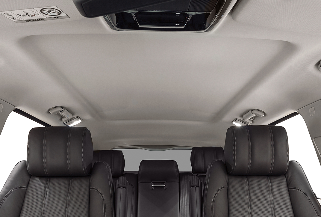 The roof liner in a car. The car seats are also visible.