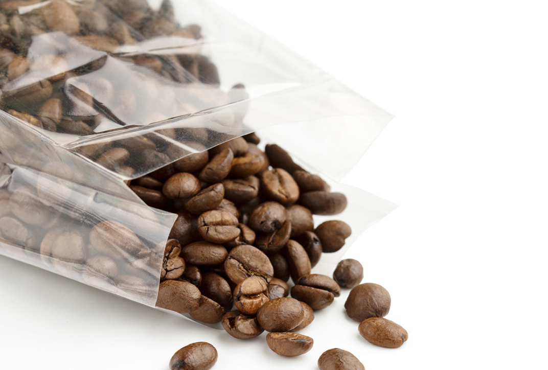 Coffee beans packaged in plastic. Coffee beans packaged in plastic.