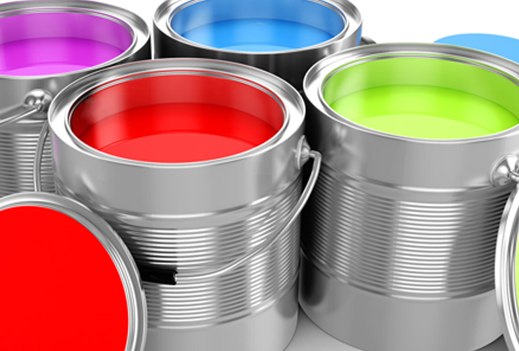 Metal cans containing paints and coatings in different colors.