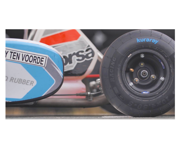 Side view of a racing car. On the right is a close-up of a tire.